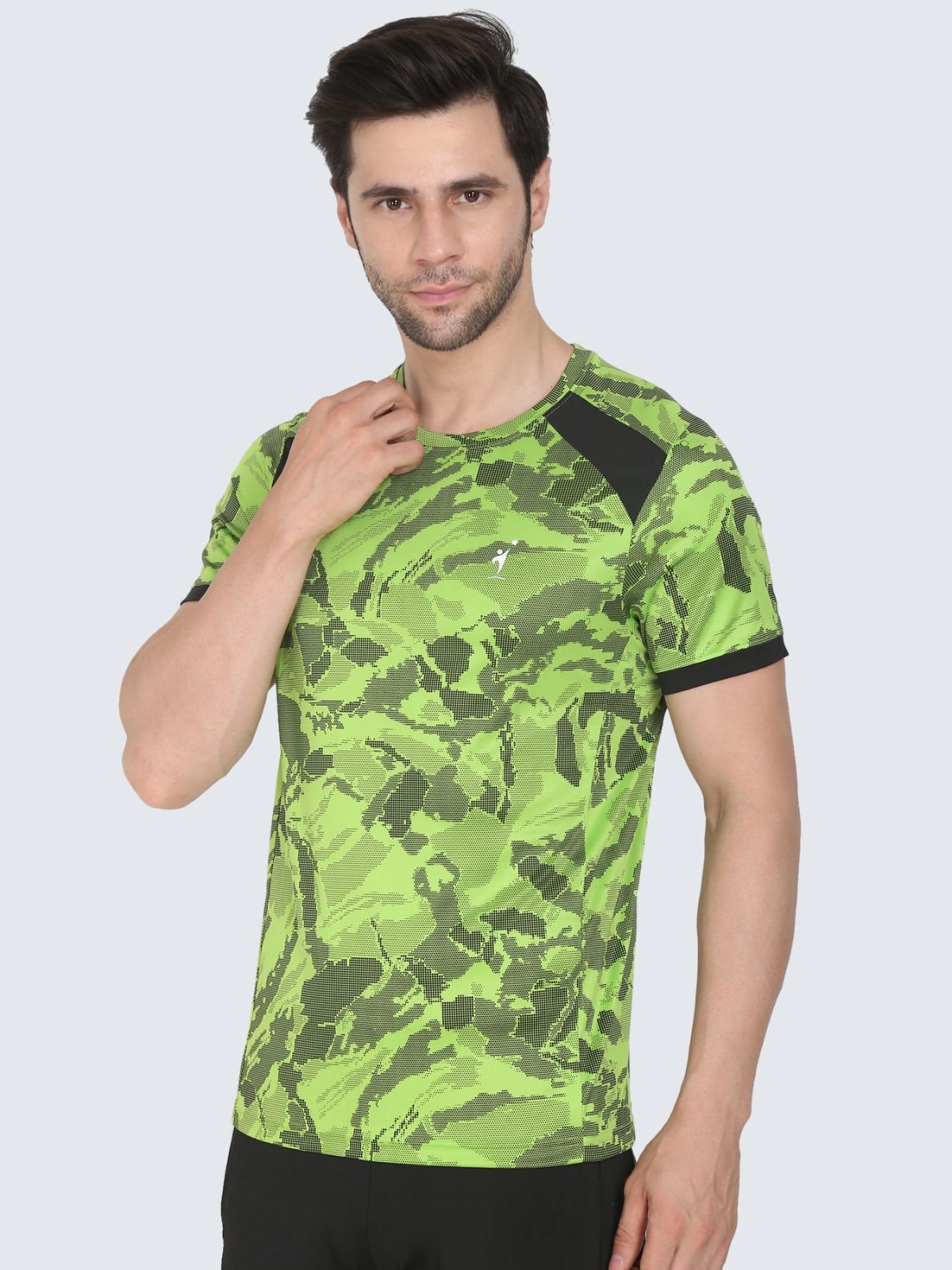 Three-quarter view of neon green camo T-shirt with black shoulder panels and white NDR SPORT logo on a white background