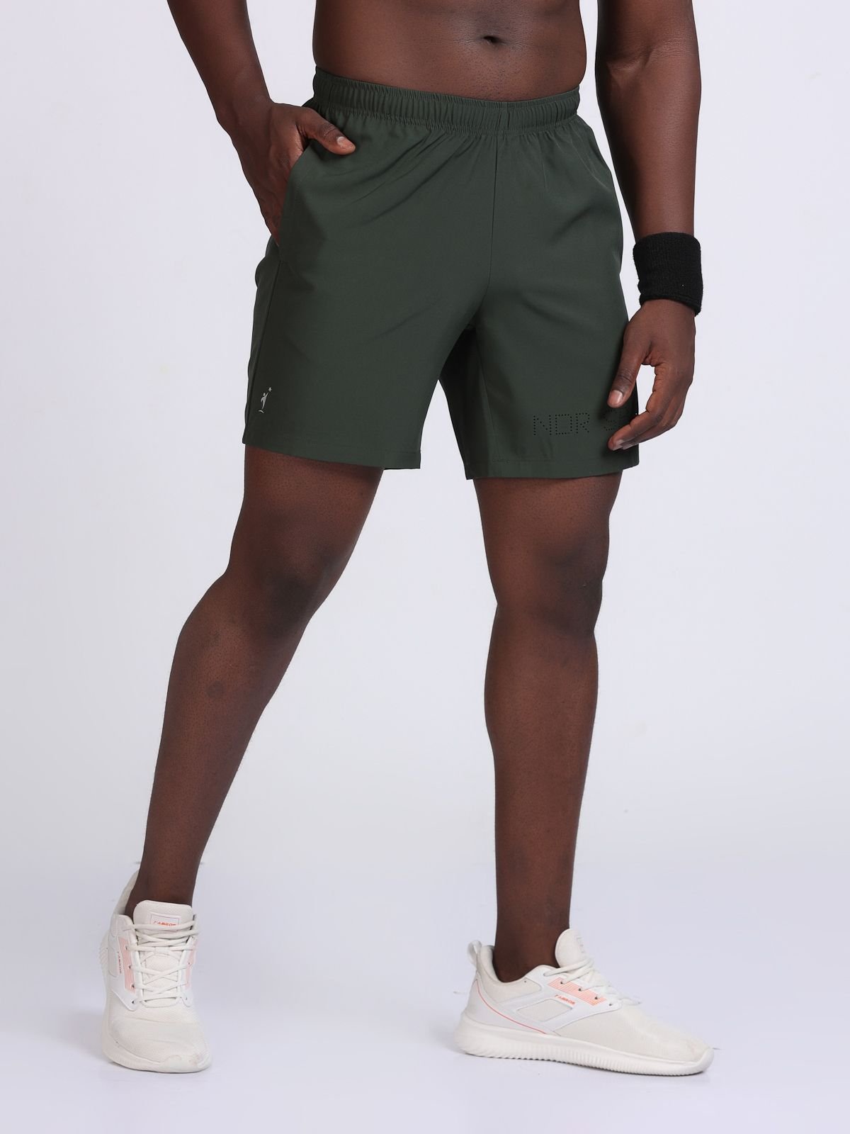 Front view of olive green athletic Feather LaserTech shorts with elastic waistband.