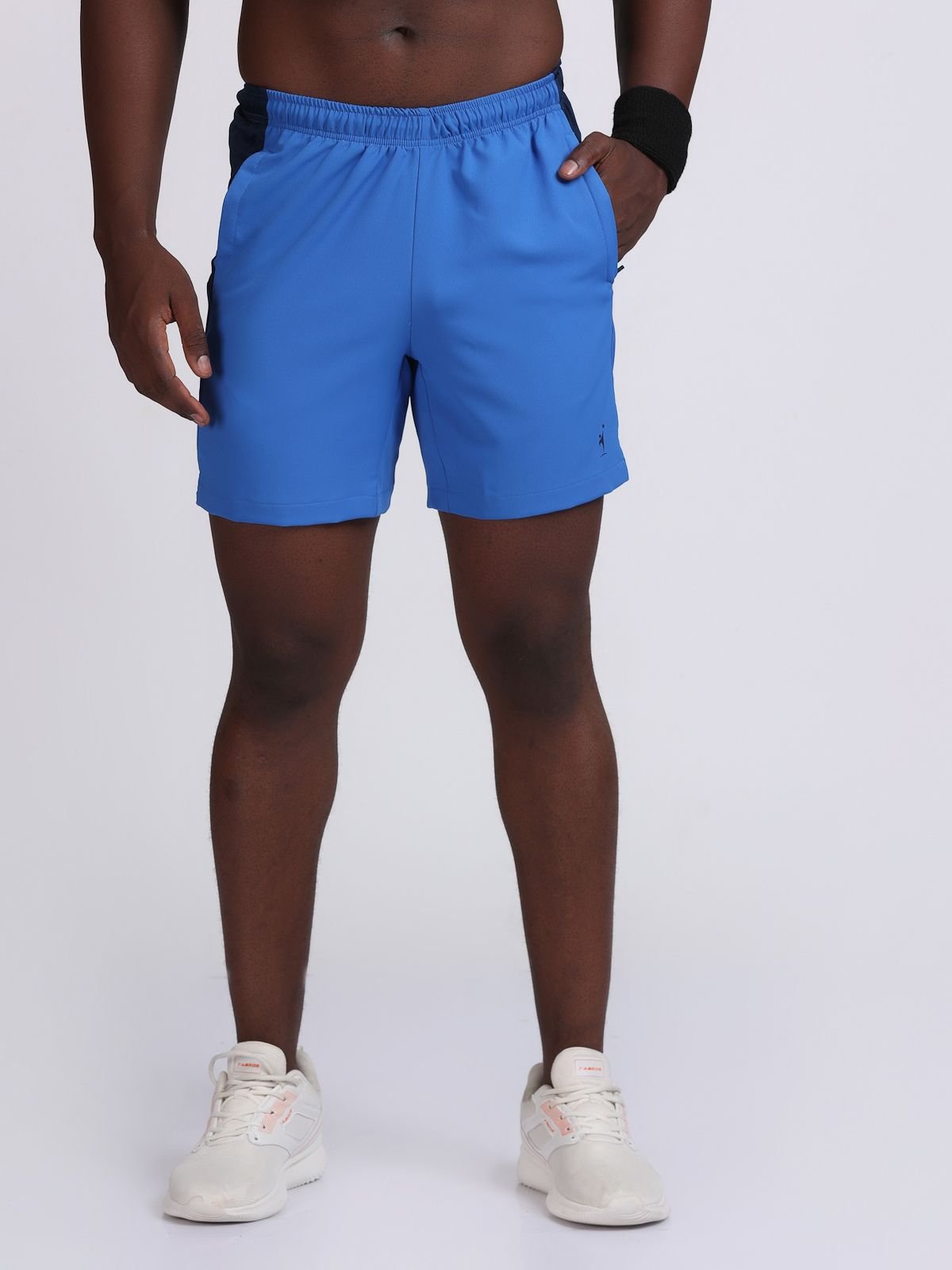 Front view of royal blue RacerStrip Performance shorts with navy waistband and side panels.