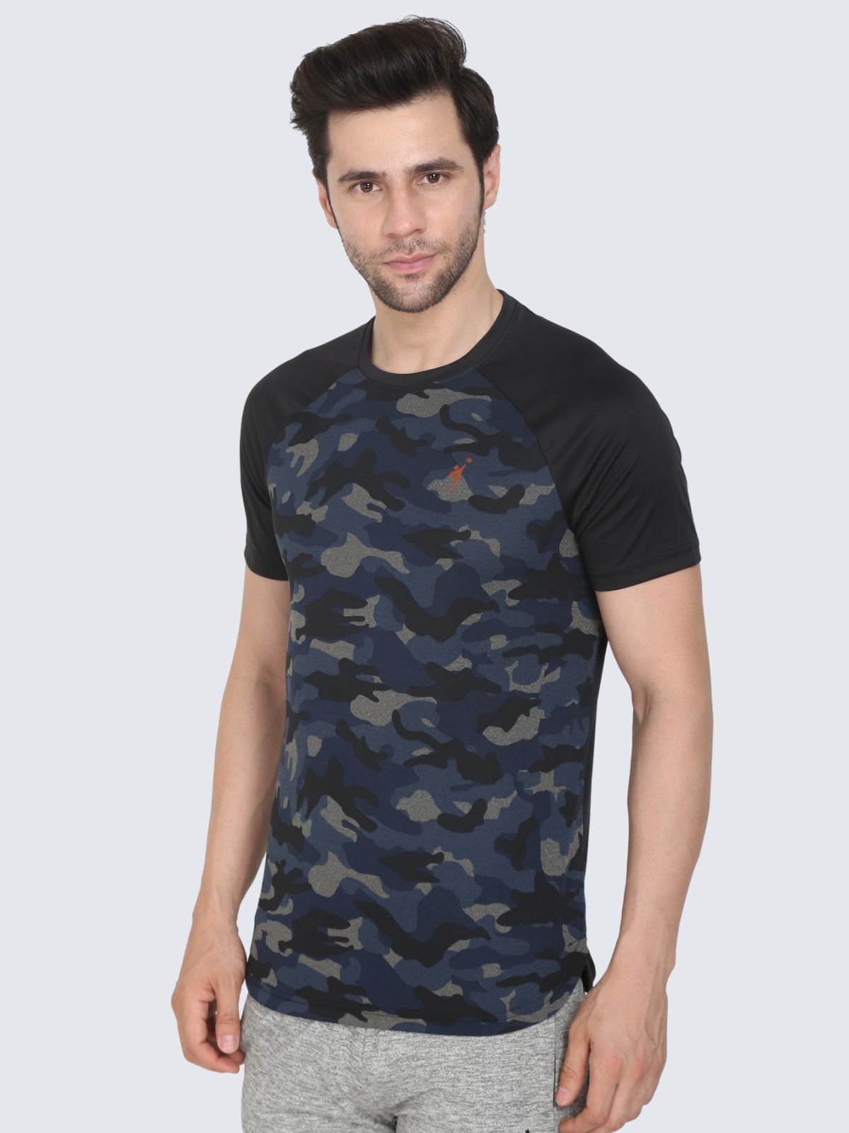Three-quarter view of navy camo raglan T-shirt with black sleeves on a white background