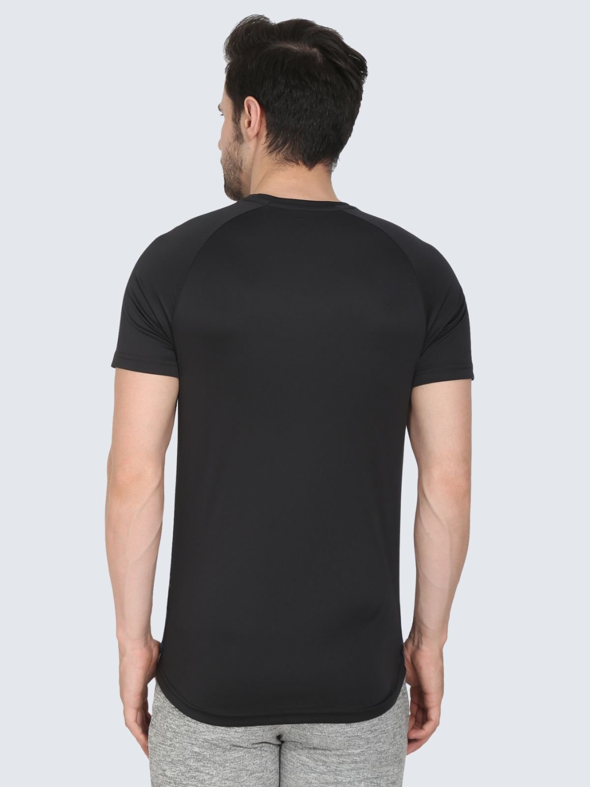 Back view of raglan T-shirt with black sleeves on a white background