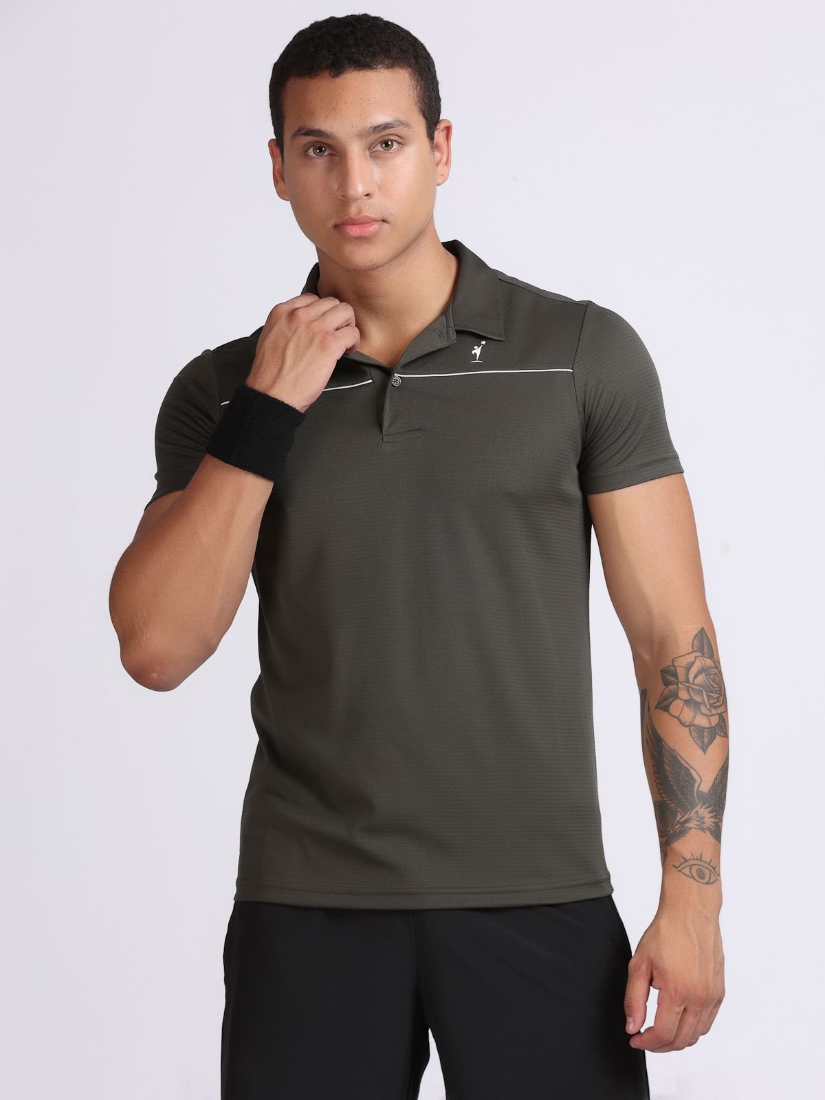 Male model wearing olive green sport polo tshirt with thin white piping, front view
