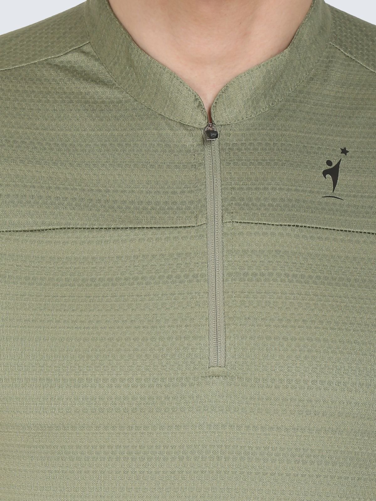 Close-up of half-zip collar and chest logo on olive textured T-shirt