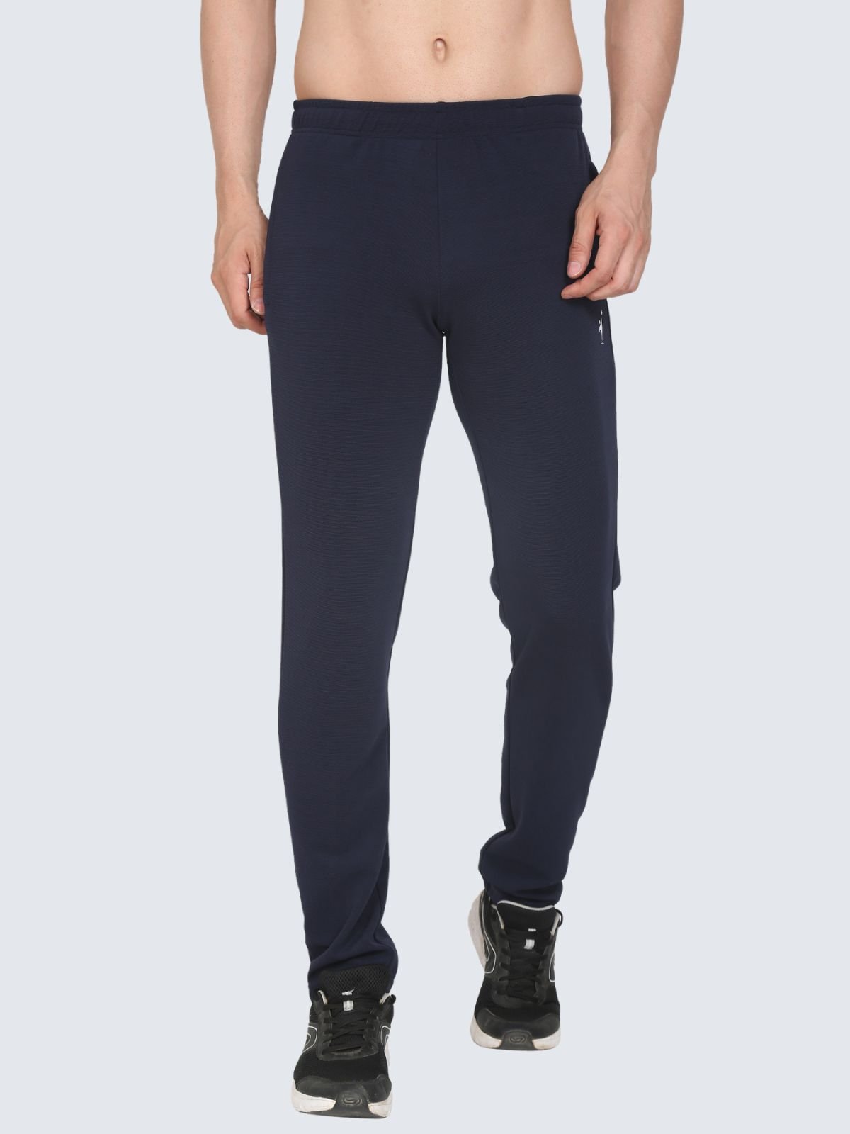 Front view of navy Regular stretch athletic pants from waist to ankles on a white background