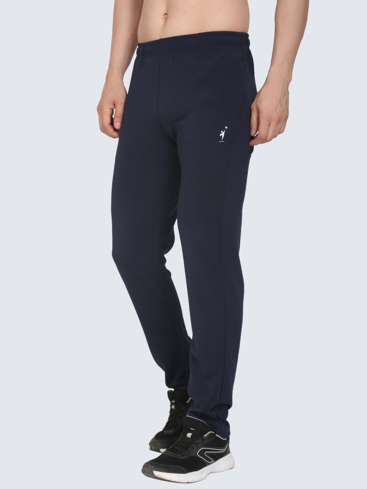 Three-quarter side view of navy regular stretch athletic pants with NDR SPORT logo on a white background