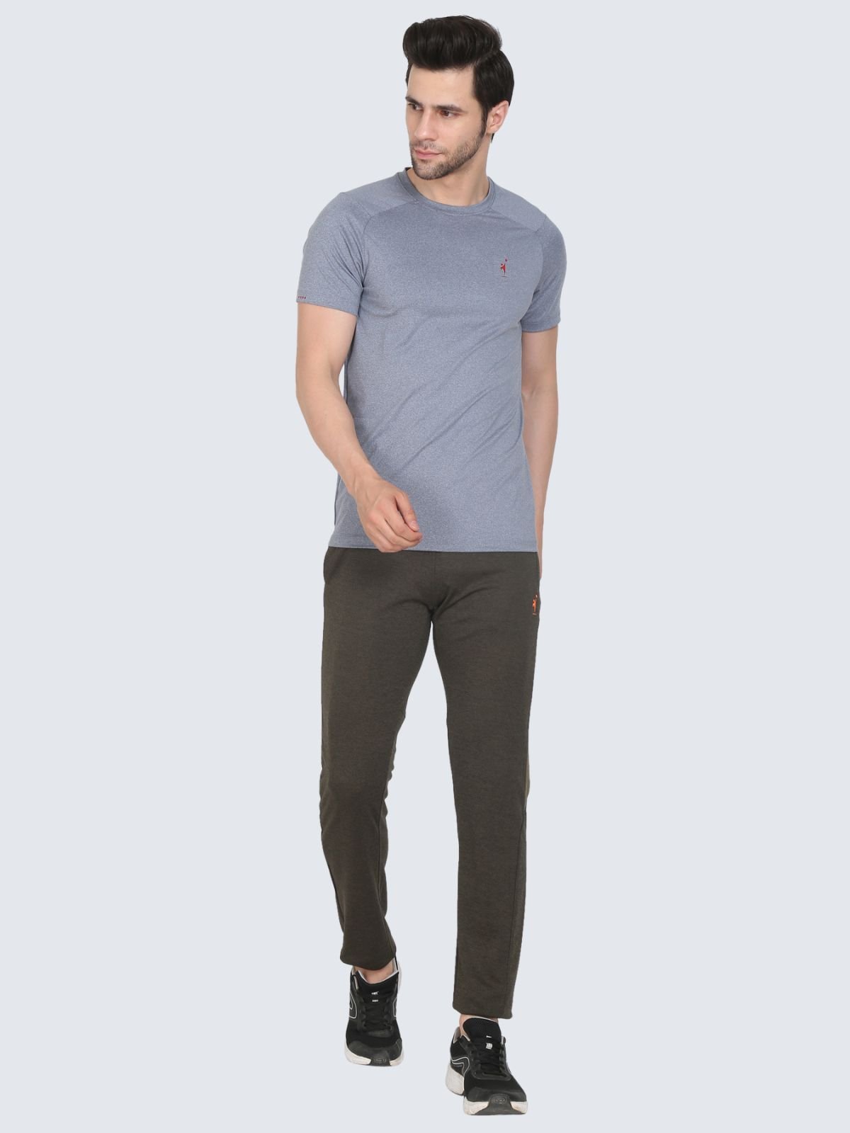 Full-body male model in grey cool N comfort tee wearing Straight Strip Olive Green athletic pants on a white background