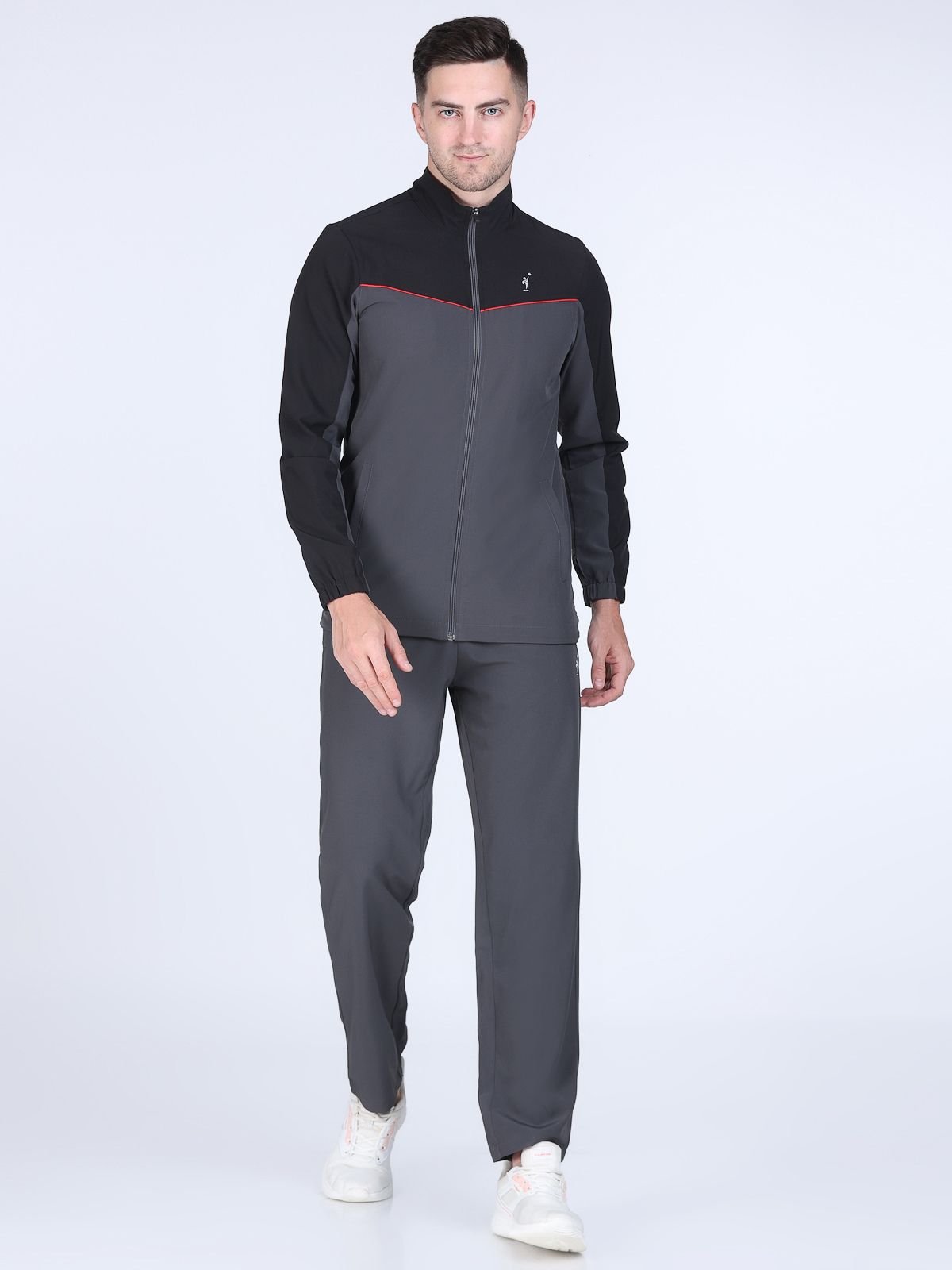 a man wearing a black and grey jacket and grey trackpant - NS Micro Tracksuit NDR SPORT
